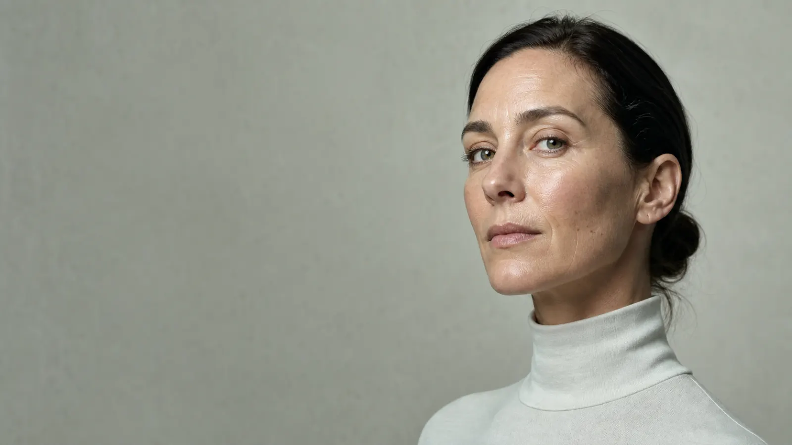 Close portrait of an adult woman with visible natural skin texture.